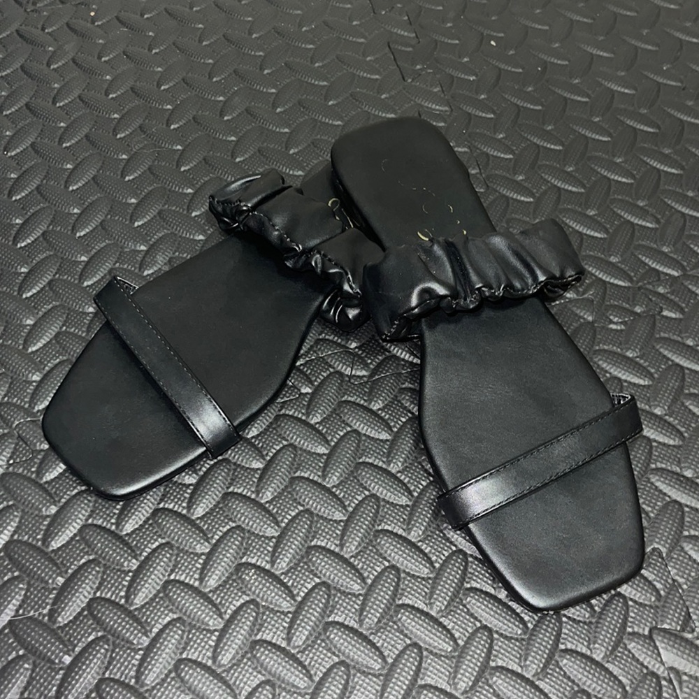 Black flat two strap sandals
